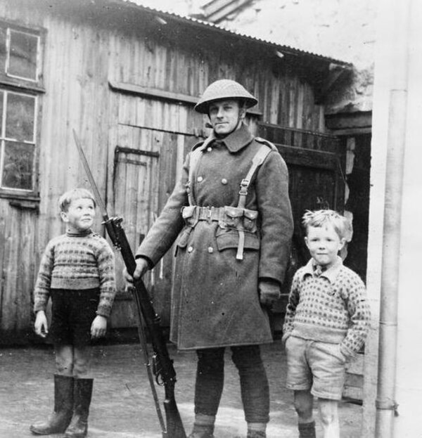 British Army soldier with local children, Tórshavn