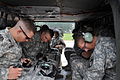 Cadets participating in the cadet troop leadership training program with the 1st Battalion, 38th Field Artillery Regiment, 210th Fires Brigade fasten their belts before a UH-60 Black Hawk helicopter flight 130808-A-WG463-042.jpg