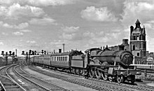 No. 2920 Saint David; from the third production series, built 1907, at Cardiff Central departing east towards Birmingham, 1953 Cardiff General Station geograph-2423641-by-Ben-Brooksbank.jpg