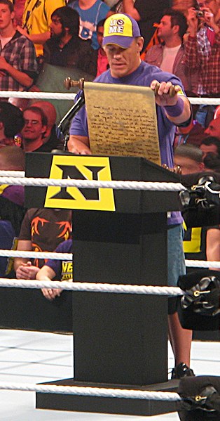 John Cena reading an address as a member of The Nexus after losing a match to Wade Barrett at Hell in a Cell