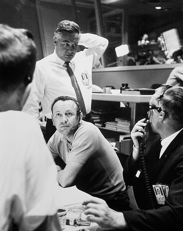 Chris Kraft (seated) confers with Walt Williams and others during Mercury-Atlas 9.