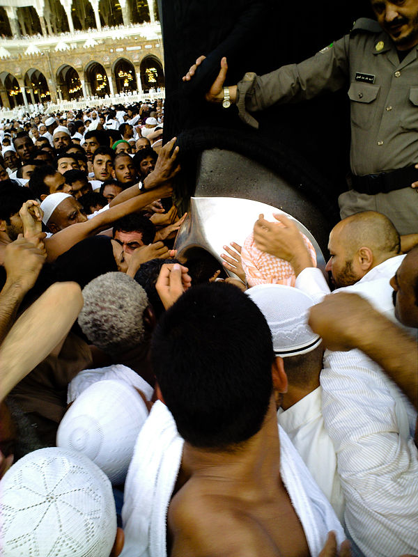 Pilgrims jostle for a chance to kiss the Black Stone; if they are unable to kiss it, they can point towards it on each circuit with their right hand