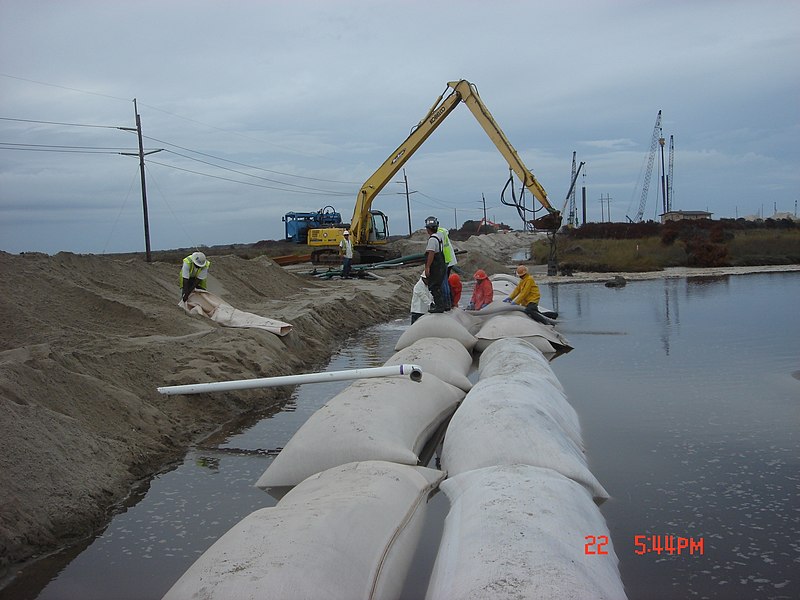 File:Crews Place Sand Bags near Temporary Bridge Site on Pea Island (6175497494).jpg