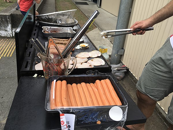 Democracy sausages being barbecued at Kenmore State School in the electoral district of Moggill, 2017 Queensland state election, 25 November 2017