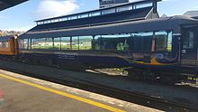 Dunedin Railways branded AO class carriage at Dunedin Railway Station. Dunedin Railways AO class carriage 2016.jpg