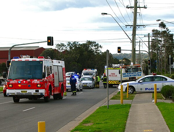 Police, fire, and medical services at the scene of a traffic collision in New South Wales, Australia