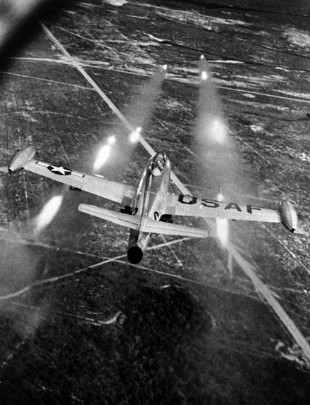An F-84E launching rockets.