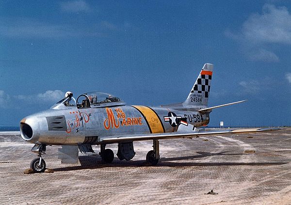 Glenn's USAF F-86F, dubbed "MiG Mad Marine", during the Korean War in 1953. The names of his wife and children are also written on the aircraft.