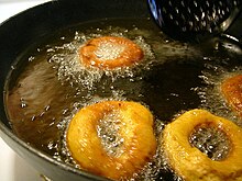 Doughnuts frying in oil Frying doughnuts.jpg