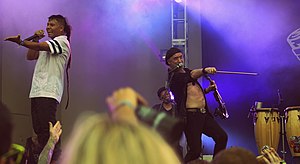 Pedro Erazo and Sergey Ryabtsev of Gogol Bordello at Lollapalooza 2015 in Chicago