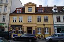 Baroque type house, including the left and right half-timbered buildings