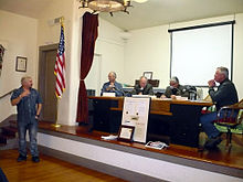 Guy Fieri receives the key to the city of Ferndale from the Ferndale City Council at a special council meeting, November 23, 2012.[63]