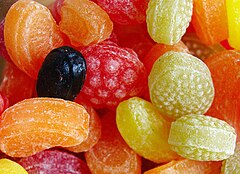 Fruit-shaped hard candy is a common type of sugar candy, containing sugar, color, flavor, and a tiny bit of water.