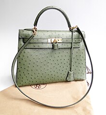 A luxury handbag. While many handbags are valued on their ability to carry objects, designer handbags are valued based on fashion. Kelly Bag.jpg