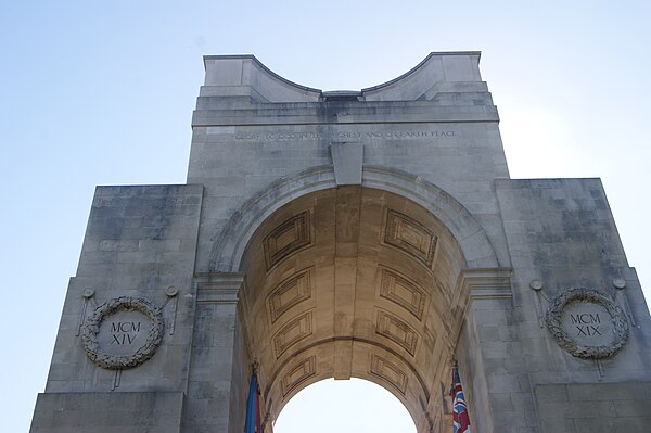 View of the top of the arch showing the flags, wreaths (on the sides), vaulted ceiling, and the dome at the summit