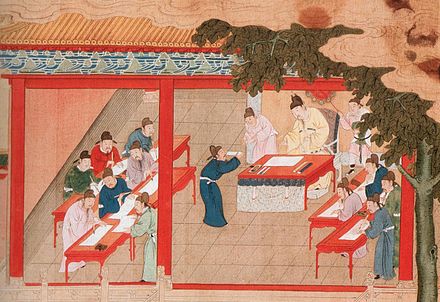 In China public examinations gave citizens the opportunity to be employed by the Imperial Government through meritocracy.[82] The examination system reached its maximum effectiveness in the 11th–12th centuries. Painting from Ming dynasty era.