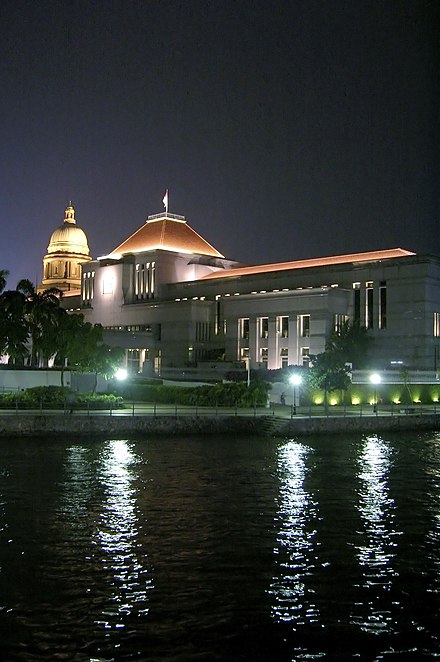 Parliament House by the Singapore River with the dome of the Old Supreme Court Building in the background, photographed on 7 September 2006