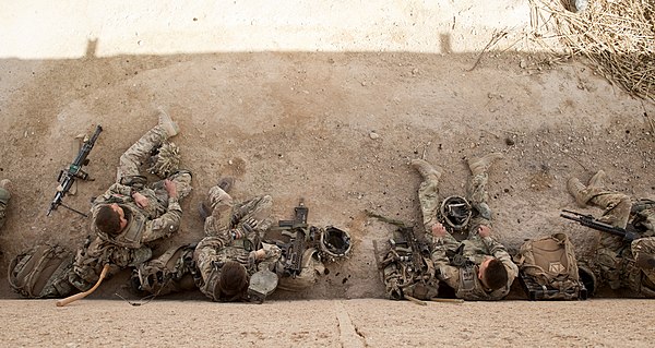 Royal Anglian Regiment soldiers during a lull in operations in Afghanistan in 2014; their numbers and equipment correspond to a British fireteam of th