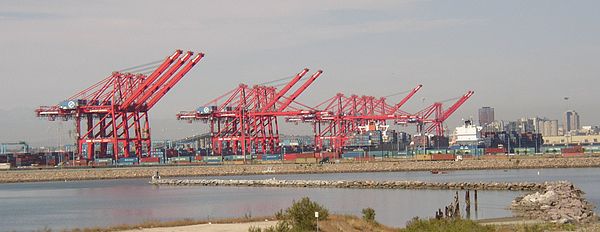 Pier T Container Terminal in Long Beach, California, U.S. with intermodal rail in the foreground and gantry cranes behind that