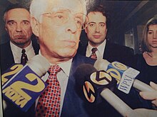 After hearing of the hung jury, Rossi attorney Jim Ecker (foreground) faces the press with attorney Alexander H. Lindsay, Richard Rossi (3rd from left, behind Ecker), and Attorney Susan Jackson at the Butler County Courthouse on March 31, 1995. RossiHungJury.JPG