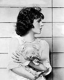 Gordon as Lola Pratt, holding her dog Flopit in the Broadway production Seventeen, 1918