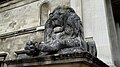 Stone lion on the exterior of the Fitzwilliam Museum in Cambridge.