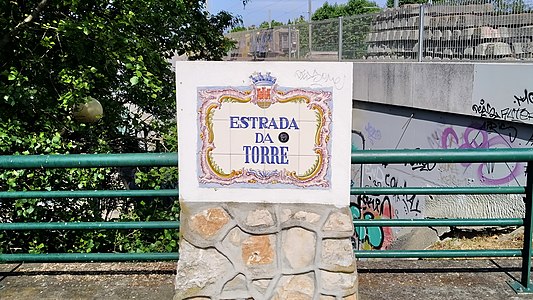 Street sign of the Estrada da Torre, corner with Rua Saudade in Carcavelos, Lisbon
