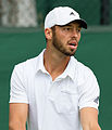 Tim Pütz competing in the first round of the 2015 Wimbledon Qualifying Tournament at the Bank of England Sports Grounds in Roehampton, England. The winners of three rounds of competition qualify for the main draw of Wimbledon the following week.