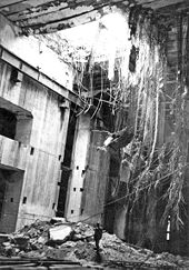 Damage caused by a Grand Slam on the Valentin submarine pen, 27 March 1945; a figure stands at the edge of the rubble U-Boat Pen Grand Slammed.jpg