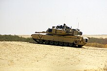 US Marine Corps (USMC) personnel in an M1A1 Abrams Main Battle Tanks (MBT) US Marine Corps (USMC) personnel in an M1A1 Abrams Main Battle Tanks (MBT) searches the area for Iraqis acting in a suspicious manner during Operation IRAQI FREEDOM. IRAQI FREEDOM i - DPLA - 0326ebebee98550b50a47e77702865df.jpeg