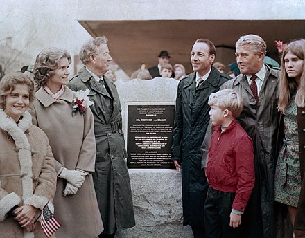 In 1970, Huntsville, Alabama, honored von Braun's years of service with a series of events including the unveiling of a plaque in his honor. Pictured (l–r), his daughter Iris, wife Maria, U.S. Sen. John Sparkman, Alabama Gov. Albert Brewer, von Braun, son Peter, and daughter Margrit.