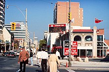 Retail stores along Yonge Street in Toronto, circa 1990, at a time when the issue of Sunday shopping was being debated in Ontario Yonge and Church Streets, looking north 1990.jpg