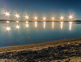 Multiple exposure of the midnight sun on Lake Ozhogino in Yakutia, Russia Poliarnyi den' nad oz. Ozhogino.jpg