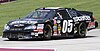 The black No. 05 State Water Heaters Chevrolet rounds a curve on the Road America course