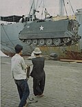 Thumbnail for File:11th Armored Cavalry Regiment M113 is lowered from the SS American Robin onto the dock in Saigon.jpg