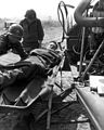 A wounded American is lifted onto a helicopter at the 21st Inf HD-SN-99-03110.jpg