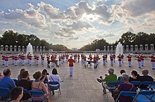 The United States Marine Drum and Bugle Corps performing the Armed Forces Medley at the Friends of the National World War II Memorial. Armed Forces Salute (7395711784).jpg