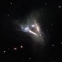 Thumbnail for File:Cosmic “flying V” of merging galaxies (8463896989).jpg