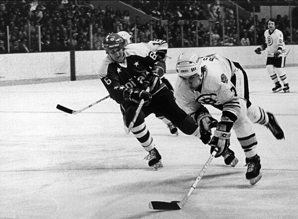 Capitals defenseman Darren Veitch chasing Boston Bruins defenseman Ray Bourque in 1980.