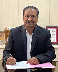 Dr. Ramesh Chakrasali at office Dr. Ramesh L. Chakrasali, Principal SDMCET.jpg