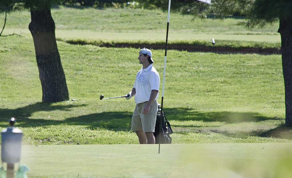 File:Golfer watches his shot on Red Course - East Potomac Park ...