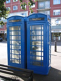 Phone boxes in St Peter Port, Guernsey, two of the four traditional K6 kiosks on the island GuernseyTelephoneBox.jpg
