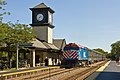 A UP/North Line train departing from Highland Park Metra station.