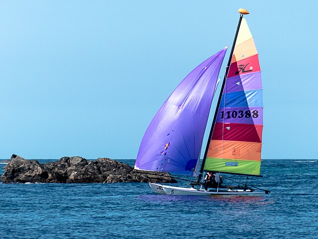 A Hobie catamaran with a masthead float to prevent turtling