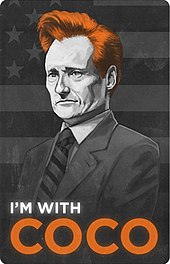 Grey, white, and orange poster of Conan O'Brien with the Caption "I'm With Coco