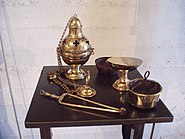 Clockwise from upper left: Thurible, cup from inside thurible, incense boat, charcoal holder, and tongs. Incensegennep.jpg