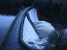 Water flowing over the spillway and the pipes in the centre of the dam Laggan Dam on 5 pipes - geograph.org.uk - 289875.jpg