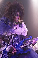 Moi dix Mois guitarist Mana performing in 2011