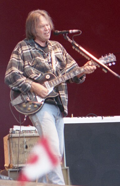 Neil Young (pictured in 1996) influenced the lyrics of "Dead Man Walking" after Bowie performed at a pair of benefit concerts for the artist in Octobe