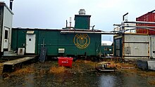 An older car repurposed as part of an ice plant on the Homer Spit Old AK railroad car.jpg